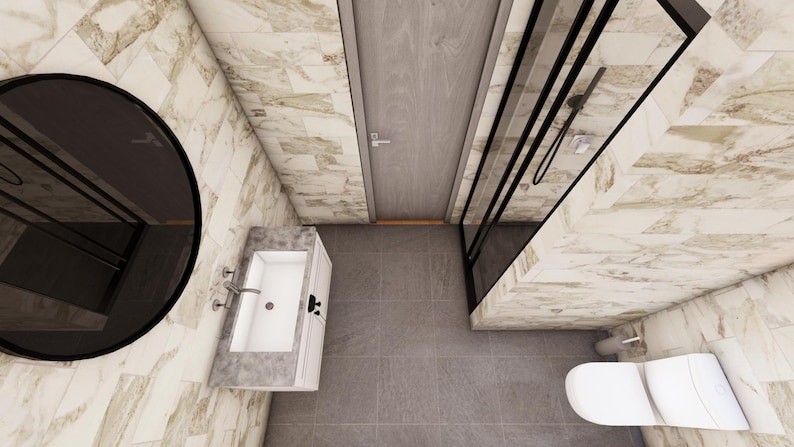 May include: An overhead view of a modern bathroom with marble-effect walls and grey tile flooring. Features include a large round mirror, a white sink with chrome fixtures, a shower enclosure, a toilet, and a wooden door.