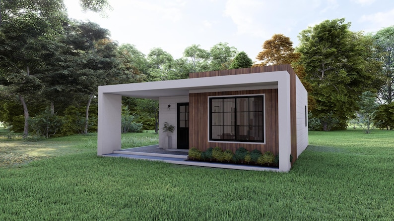 May include: A modern, single-story house with a flat roof and a covered porch. The exterior features white walls, wooden accents, and large windows. The house is surrounded by green grass and trees.