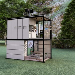 Op de afbeelding: Een modern, tweeledig tiny house met een zwart frame en witte gevelbekleding. De structuur heeft grote ramen, een klein balkon en een minimalistisch interieur. Het huis staat op een grasveld met bomen en een rotsachtige heuvel op de achtergrond.