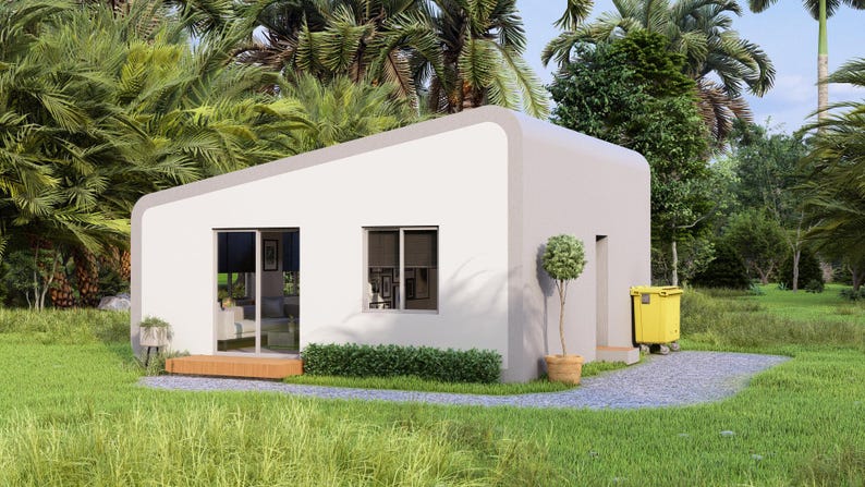 May include: A contemporary, white, single-storey house with a flat roof and curved edges. The house features large windows and a sliding glass door. A small potted tree is near the entrance, and a yellow bin is visible. The house is set in a green garden with palm trees.