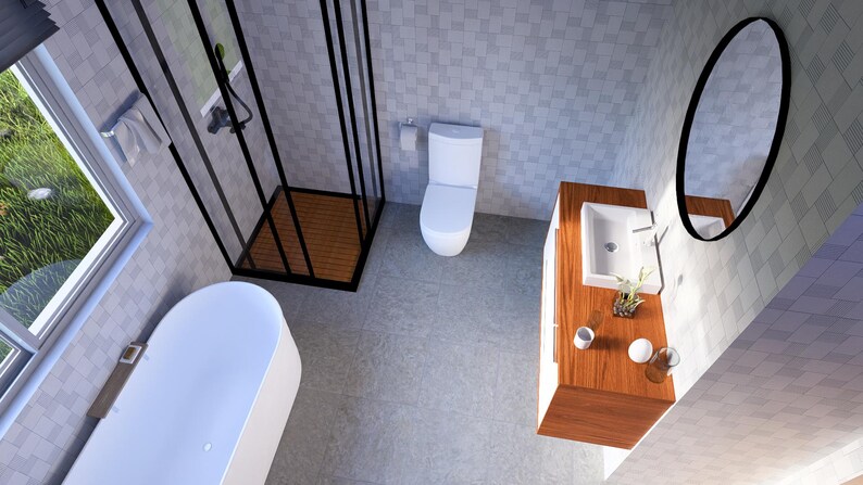 May include: A modern bathroom featuring a white bathtub, toilet, and sink. A black-framed shower and an oval mirror are also visible. The walls are tiled in a light grey pattern, and the floor is a matching grey.