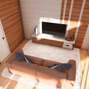 May include: An interior shot of a modern living space with a brown sofa, a white rug, and a wall-mounted TV. The walls are a mix of wood paneling and white paint. A white door and a black piano are also visible.