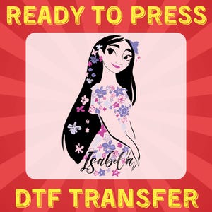 May include: A digital transfer design featuring a cartoon illustration of a woman with long black hair and a floral dress. The design includes the name "Isabela" in a stylized font. The design is ready to be pressed onto a t-shirt or other fabric.