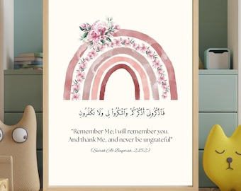May include: A framed print featuring a watercolor rainbow in shades of pink and red, adorned with floral accents. The print includes Arabic text and English translation: "Remember Me; I will remember you. And thank Me, and never be ungrateful."