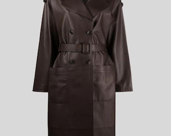 May include: A brown leather trench coat with a double-breasted design, a belt, and large pockets. The coat has a classic trench coat collar and button details on the shoulders. The coat is approximately 55 inches long.
