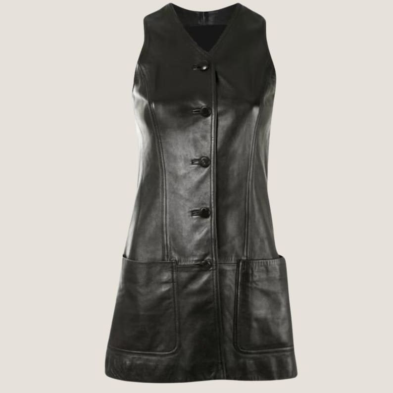 May include: A black leather sleeveless dress with a button-up front and two large pockets on the sides.