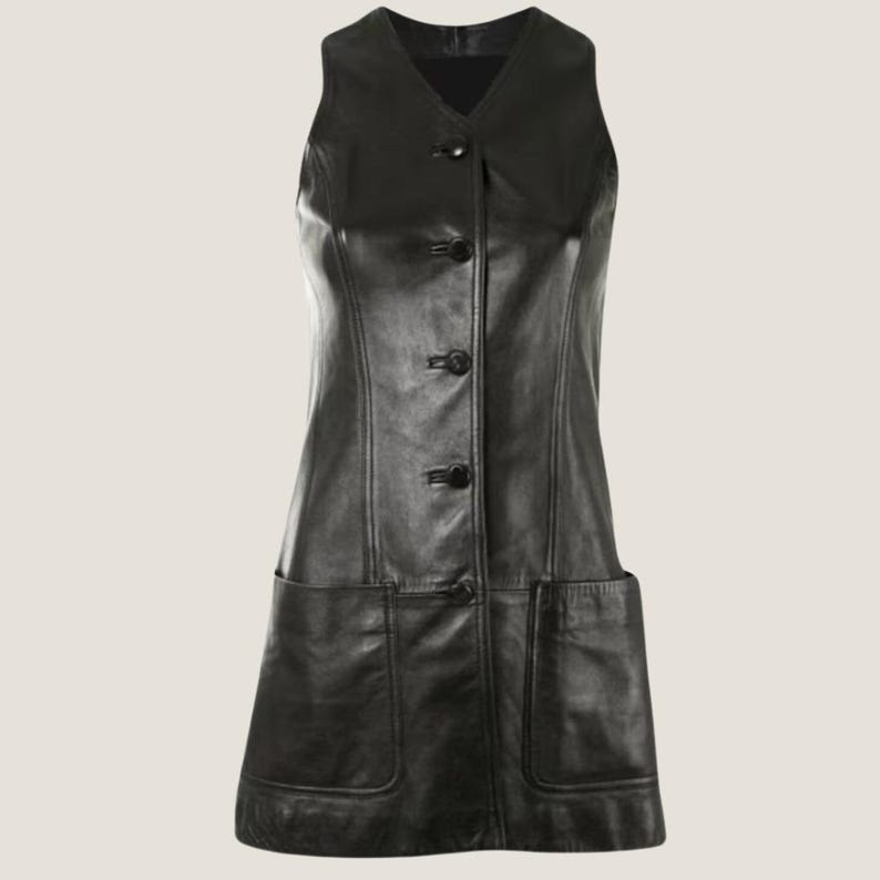 May include: A black leather sleeveless dress with a button-up front and two large pockets on the sides.