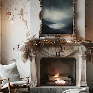 May include: A white fireplace with a lit fire inside. The fireplace is decorated with a garland of dried branches and white lights. A framed painting of a landscape hangs above the fireplace.