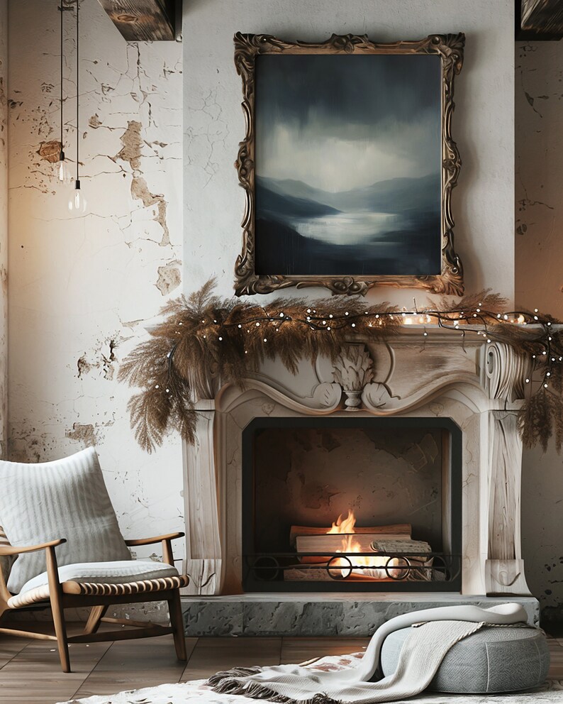 May include: A white fireplace with a lit fire inside. The fireplace is decorated with a garland of dried branches and white lights. A framed painting of a landscape hangs above the fireplace.