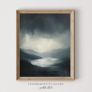 Moody landscape in blue tones, showing a mountain lake under a cloudy sky painting.