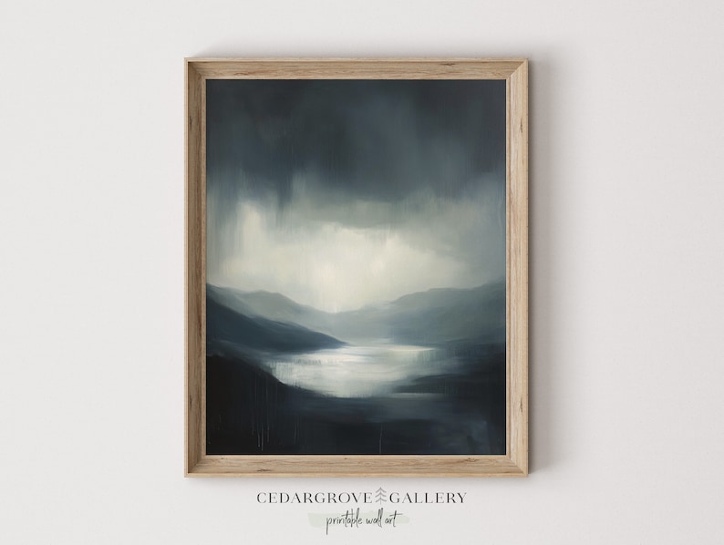 Moody landscape in blue tones, showing a mountain lake under a cloudy sky painting.
