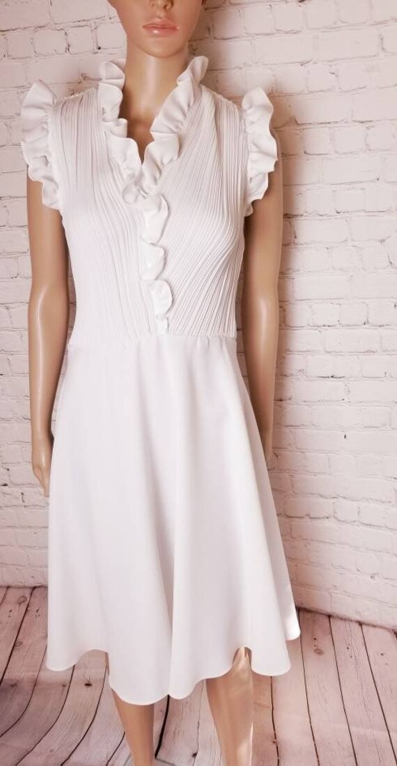 white disco skater dress with accordion pleats and