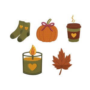 May include: An embroidered design featuring fall-themed elements. Includes a pair of green socks with heart accents, an orange pumpkin with a pink bow, a coffee cup, a candle, and a brown leaf. All elements have a stitched appearance.