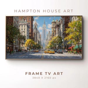 May include: A framed painting of a New York City street scene, featuring the Empire State Building in the distance. The artwork showcases yellow taxis, buildings, and trees. The text "HAMPTON HOUSE ART" and "FRAME TV ART" are visible.