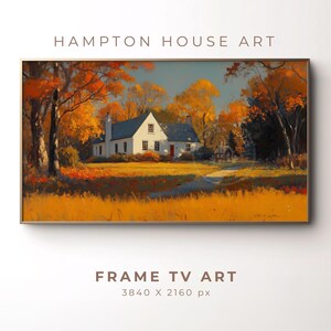 Può includere: Una stampa artistica digitale incorniciata raffigurante una casa bianca con una porta rossa, ambientata in un paesaggio autunnale. L'opera mostra alberi con foglie arancioni e gialle, sotto un cielo blu. Il testo in alto recita "HAMPTON HOUSE ART".