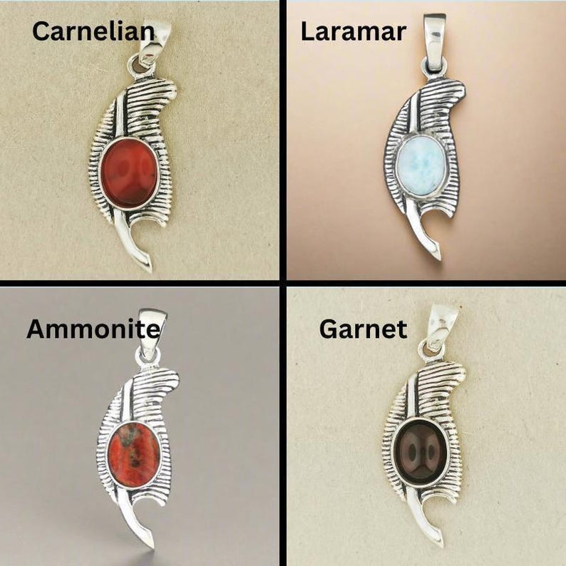 Close-up of silver Feather of Ma’at pendant ancient Egypt necklace. Handmade Maat feather jewelry in silver Egyptian symbol of balance