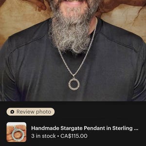 a man with a long beard and a beard ring
