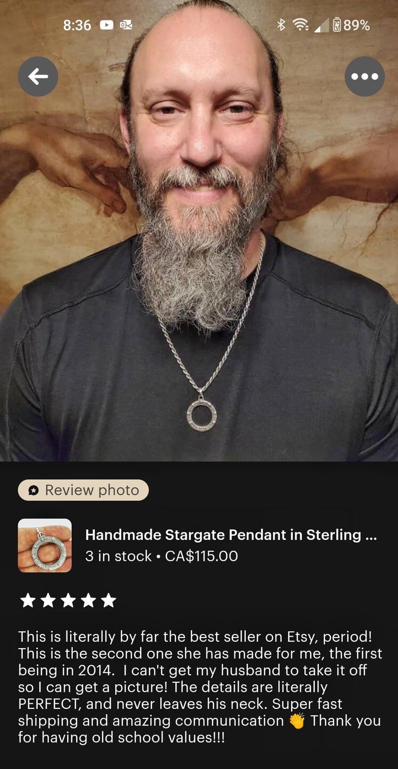 a man with a long beard and a beard ring