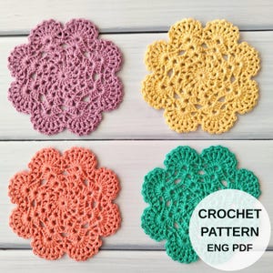 May include: Four circular crochet coasters in purple, yellow, coral, and teal, each featuring a detailed floral-inspired openwork design. A white circular overlay in the bottom right corner displays the text CROCHET PATTERN ENG PDF.