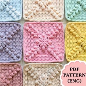 May include: A collection of colorful, square crochet patterns in various pastel shades, including pink, blue, and yellow. Each square features a central floral design and textured details. The image includes the text "PDF PATTERN (ENG)".