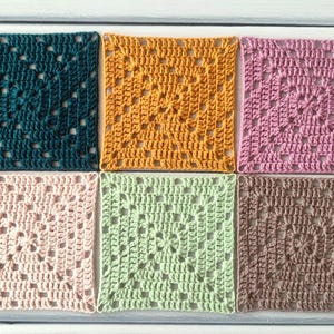 May include: Six square crochet coasters arranged in two rows of three. The colours include dark teal, mustard yellow, dusty pink, light blush, sage green, and taupe. Each piece features a classic openwork granny square pattern with yarn stitches.
