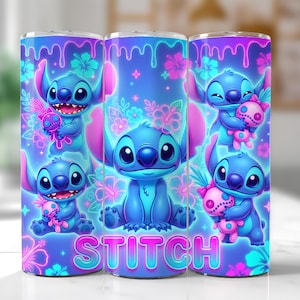 May include: A set of three stainless steel tumblers featuring a vibrant design of the character Stitch from Lilo & Stitch. The design includes Stitch holding a doll, surrounded by flowers, with the word "STITCH" at the bottom. The tumblers have a blue and pink color scheme.