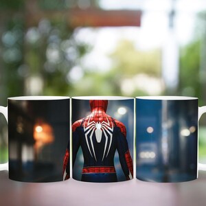 May include: White ceramic mug featuring a design of the Spider-Man character. The design shows the character's back in a red and black suit with a white spider emblem. The background scenes include cityscapes and blurred interiors.