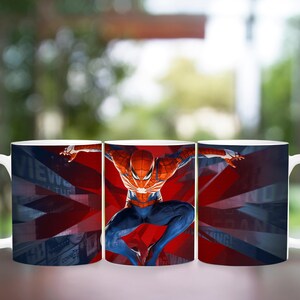 May include: White ceramic mug featuring a vibrant image of Spider-Man in a dynamic pose against a red and blue background. The design includes a stylized Union Jack pattern. The mug has a curved handle.