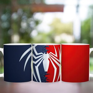 May include: Three white ceramic mugs with different designs. One mug is navy blue with a white spider web design. The second mug has a split design of navy blue and red with a white spider web. The third mug is solid red.