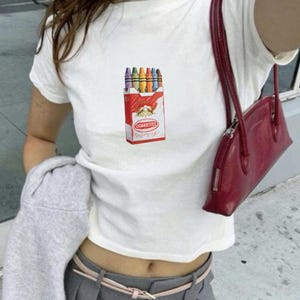 Crayon Cigarettes Baby Tee: Y2K Cropped T-Shirt Featuring a Pack of Cigarettes Filled With Crayons, 2000s 90s Aesthetic Graphic Tee