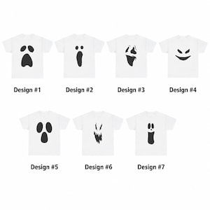 May include: Seven white short-sleeved t-shirts arranged in two rows, each featuring a unique black graphic of a ghost face. The shirts are labelled Design #1 through Design #7, showcasing various expressions including wide eyes, jagged mouths, and simple shapes.