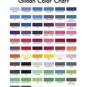 May include: A Gildan Color Chart featuring a grid of rectangular colour swatches with corresponding names printed below each. The chart displays a wide variety of shades including blues, purples, reds, oranges, yellows, neutrals, and greens.