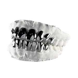 CAD-designed grillz with medical-grade precision, crafted in gold or silver with high-gloss polish and fast delivery