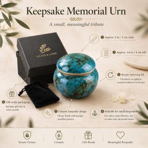 May include: A turquoise ceramic keepsake memorial urn with a marbled pattern and a secure twist-top lid. The urn is 2 inches wide and 1.6 inches tall. It includes a black gift box with the Olive & Lune logo and a black velvet pouch for storage.