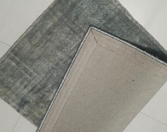 Handgetufteter Teppich