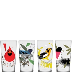 May include: Set of four clear drinking glasses with colorful bird illustrations. Each glass features a different bird design: a red cardinal, a blue bird in a nest, a yellow and black bird, and a black and pink bird.
