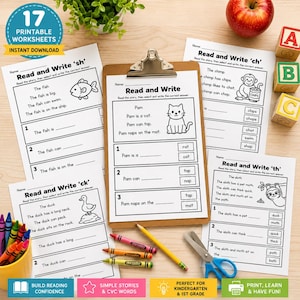 May include: Educational worksheets for early readers. The image shows several "Read and Write" worksheets with fill-in-the-blank sentences and illustrations. Includes a clipboard, crayons, scissors, and wooden alphabet blocks. A red apple and a small plant are also visible.