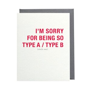 May include: A white card with red text that reads "I'm sorry for being so Type A / Type B (circle one)"