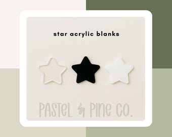 May include: Three star-shaped acrylic blanks in clear, black, and white. The text "star acrylic blanks" is above the stars, and the text "PASTEL & PINE CO." is below. The stars are displayed on a white background.