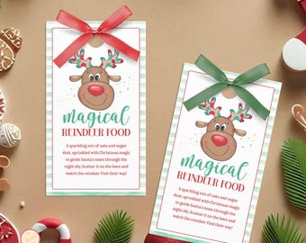 May include: Two rectangular gift tags with red and green ribbons. Each tag features a cartoon reindeer with the text "magical REINDEER FOOD". The tags have a white background with a light green striped border and text describing the product.