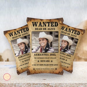 May include: Three custom chip bags with a 'Wanted' poster design. Each bag features a photo of a woman in a cowboy hat, with text that reads 'Wanted Dead or Alive' and 'Samantha Joel'. The bags have a vintage, rustic aesthetic.