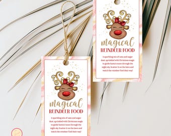 May include: Two rectangular gift tags with a reindeer design and the words "Magical Reindeer Food." The tags have a pink and gold watercolor background and are tied with twine. The text on the tags describes the contents.