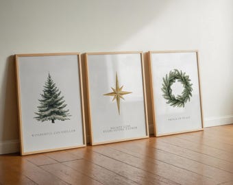May include: Three framed art prints with a Christmas theme. The prints feature a watercolor evergreen tree, a gold star, and a green wreath. Each print has text at the bottom: "Wonderful Counsellor", "Mighty God Everlasting Father", and "Prince of Peace".