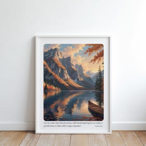 Puede incluir: Una impresión artística enmarcada que presenta un paisaje sereno con montañas, un lago y una canoa. La obra de arte utiliza colores cálidos de naranja, amarillo y azul. El texto en la parte inferior dice: "Entremos ante su presencia con acción de gracias; aclamémosle con cánticos!"
