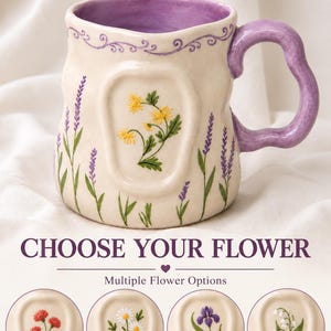 May include: A cream-colored ceramic mug with a wavy purple handle and interior, featuring hand-painted lavender sprigs and a central yellow flower. Below, the text CHOOSE YOUR FLOWER appears above four circular icons showing red, daisy, iris, and lily designs.