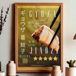 May include: Framed print of a gyoza or jiaozi recipe. The artwork depicts a dumpling held by chopsticks, with English and Japanese text. The print has a wooden frame and a golden background with five gold stars.