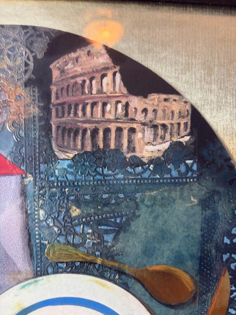 Zoomed-in portion highlighting the Roman Colosseum at the top right of the collage. A golden spoon floats below it, and the intricate blue lace pattern continues across the background. Subtle paint texture and cut paper shapes bring depth and complexity to this section.