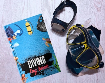 May include: A blue diving log book with illustrations of scuba gear, a turtle, and an octopus. The book has the words "DIVING log book" in black and white text.
