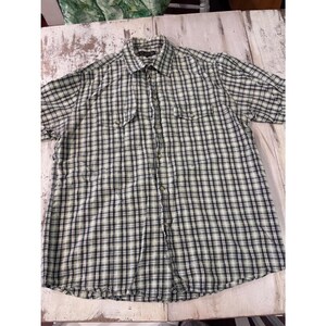 May include: A short-sleeved button-down shirt featuring a plaid pattern in shades of olive green, black, and white. The shirt includes a standard collar, a full-length front button placket, and two chest pockets with buttoned flaps on each side.