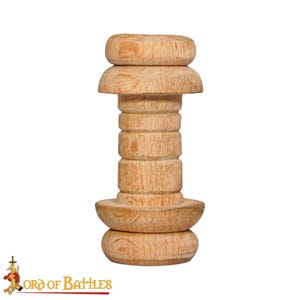 May include: A light-colored wooden candlestick with a unique, layered design. The candlestick features a series of stacked, rounded elements, creating a visually interesting shape. The base and top are wider, while the middle section is narrower, giving it a distinctive look.